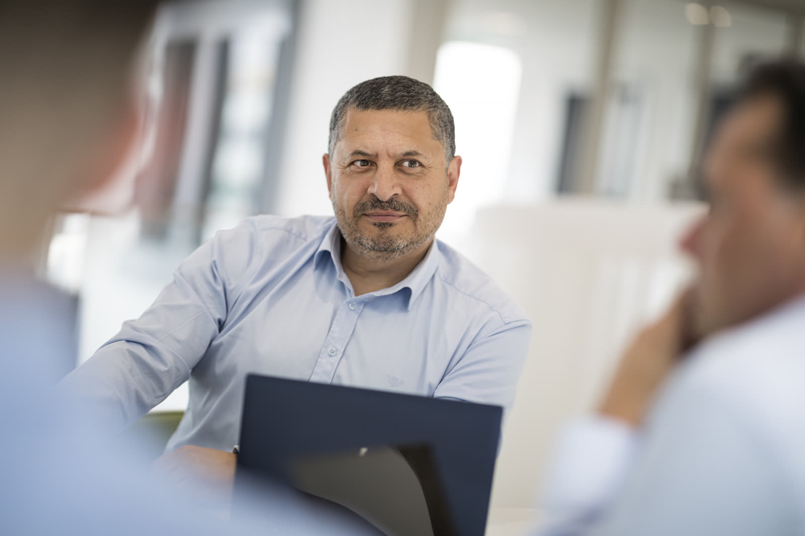 A We Can managed-services team working alongside a client in their Rotterdam office